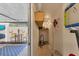 Garage storage and utility area with painted walls and adjacent outdoor patio area at 1500 Sunset Rd # B4, Tarpon Springs, FL 34689