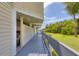 Outdoor walkway with wooden planks and a glimpse of the property's surroundings at 1500 Sunset Rd # B4, Tarpon Springs, FL 34689