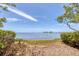 A scenic view of the water featuring lush greenery on either side, offering a serene and private waterfront experience at 1500 Sunset Rd # B4, Tarpon Springs, FL 34689
