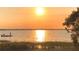 Breathtaking waterfront view with a calm lake at sunset and fisherman at 1500 Sunset Rd # B4, Tarpon Springs, FL 34689