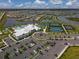Stunning aerial view of resort-style amenities, lush landscaping, and a vibrant community at 15344 Serene Shores Loop, Bradenton, FL 34211