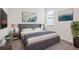 Well-lit bedroom with modern decor, neutral tones, and large window for ample natural light at 15344 Serene Shores Loop, Bradenton, FL 34211