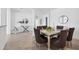Dining room with a glass table and modern decor at 15344 Serene Shores Loop, Bradenton, FL 34211