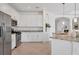 Bright modern kitchen with white cabinets, stainless appliances, and tile flooring at 15344 Serene Shores Loop, Bradenton, FL 34211