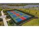 Aerial view of the community pickleball courts surrounded by a lake and green space at 15344 Serene Shores Loop, Bradenton, FL 34211