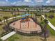 Aerial view of the community playground with swings and other play equipment at 15344 Serene Shores Loop, Bradenton, FL 34211