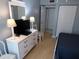 Cozy bedroom featuring twin beds, dresser, and plenty of closet space at 1801 Gulf N Dr # 207, Bradenton Beach, FL 34217