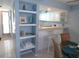 Dining area beside kitchen, featuring built-in shelves and tile flooring at 1801 Gulf N Dr # 207, Bradenton Beach, FL 34217
