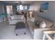 Bright living room with tile flooring, comfortable seating, and stylish decor at 1801 Gulf N Dr # 207, Bradenton Beach, FL 34217