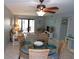 Living room with access to balcony, a dining area, and comfortable seating at 1801 Gulf N Dr # 207, Bradenton Beach, FL 34217