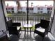 Charming patio with comfortable seating overlooking the water at 1801 Gulf N Dr # 207, Bradenton Beach, FL 34217