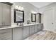Bathroom featuring dual sinks, modern cabinets, marble counters and decorative tiled backsplash at 19351 Ranchview Ct, Land O Lakes, FL 34638