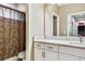 Bathroom with white marble countertop and cabinets, a toilet, and a bathtub with a shower at 19351 Ranchview Ct, Land O Lakes, FL 34638