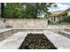 Outdoor entertaining space showcases a stone fire pit area with built in seating for many people at 19351 Ranchview Ct, Land O Lakes, FL 34638