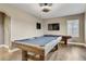 Entertainment room with a pool table, television, and hardwood floors at 19351 Ranchview Ct, Land O Lakes, FL 34638