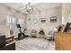 Bright home office featuring modern exercise equipment, comfortable seating, and ample natural light at 19351 Ranchview Ct, Land O Lakes, FL 34638