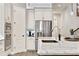 Modern kitchen featuring stainless steel appliances, marble countertops, and white cabinets at 19351 Ranchview Ct, Land O Lakes, FL 34638