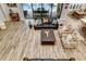 Bright living room with backyard view and hardwood floors and comfortable seating arrangement at 19351 Ranchview Ct, Land O Lakes, FL 34638