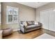 Inviting living room with modern sofa, lots of light, hardwood floors, and cozy beanbag chair at 19351 Ranchview Ct, Land O Lakes, FL 34638