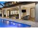 Beautiful outdoor living area with multiple seating areas, a ceiling fan, outdoor TV, and view of the pool at 19351 Ranchview Ct, Land O Lakes, FL 34638