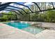 A large screened-in swimming pool features a jacuzzi, decorative fountains, and plenty of space for recreation at 19351 Ranchview Ct, Land O Lakes, FL 34638
