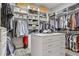 Spacious walk-in closet with custom shelving, drawers, and an island for organization at 19351 Ranchview Ct, Land O Lakes, FL 34638