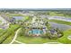 Community pool and amenities surrounded by lush landscaping, walking paths, and scenic water views at 2108 Citrus Breeze Dr, Bradenton, FL 34208