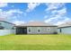 Large, well-maintained backyard with green grass offering a serene outdoor space for relaxation and activities at 2108 Citrus Breeze Dr, Bradenton, FL 34208