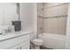 Well-lit bathroom showcasing a single sink vanity with a quartz countertop, and a tiled shower/tub combo at 2108 Citrus Breeze Dr, Bradenton, FL 34208