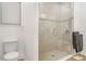Elegant bathroom featuring a tiled walk-in shower with a glass door and modern fixtures at 2108 Citrus Breeze Dr, Bradenton, FL 34208