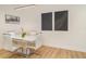 Contemporary dining room with white table, seating for four, and stylish artwork on the walls at 2108 Citrus Breeze Dr, Bradenton, FL 34208