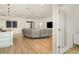 Bright open-concept living space with light hardwood floors, contemporary decor, and lots of natural light at 2108 Citrus Breeze Dr, Bradenton, FL 34208
