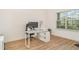Well-lit home office space with modern desk, comfortable chair, and a view of the outdoors at 2108 Citrus Breeze Dr, Bradenton, FL 34208