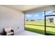 Enjoy the outdoors from the screened-in patio, offering a serene view of the pond and lush backyard at 2108 Citrus Breeze Dr, Bradenton, FL 34208