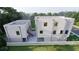 New townhome featuring a white fence, patio, and a backyard with large trees at 2146 5Th N Ave, St Petersburg, FL 33713