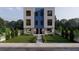 Modern two-story townhome with a blue central accent, black windows, and landscaped front yard at 2146 5Th N Ave, St Petersburg, FL 33713