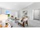Spacious living room with natural light, neutral color palette, and contemporary furnishings at 22033 Voltair Ave, Port Charlotte, FL 33954