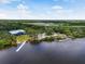 Community center with pier access is surrounded by lush vegetation and serene river waters at 2347 123Rd E Pl, Parrish, FL 34219