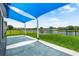 Backyard with tranquil pond views and relaxing shaded patio at 2347 123Rd E Pl, Parrish, FL 34219