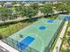 Aerial view of a community basketball court featuring a green court and black fencing at 2347 123Rd E Pl, Parrish, FL 34219