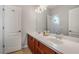 Bathroom with a double sink vanity, dark wood cabinets, and tile flooring at 2347 123Rd E Pl, Parrish, FL 34219