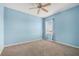 Cozy bedroom with a ceiling fan and natural light from window with blinds at 2347 123Rd E Pl, Parrish, FL 34219