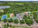 Aerial shot of a community featuring a pool, playground, tennis, and basketball courts for active lifestyles at 2347 123Rd E Pl, Parrish, FL 34219
