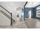 Grand foyer showcases staircase and views of dining and living spaces with hardwood floors at 2347 123Rd E Pl, Parrish, FL 34219
