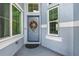 Eye-level front door view features glass windows and neutral paint, with natural light at 2347 123Rd E Pl, Parrish, FL 34219