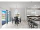 Eat-in kitchen area with a chandelier, bar stool seating, and a view of the kitchen at 2347 123Rd E Pl, Parrish, FL 34219