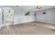 Open living room with luxury vinyl plank flooring and a view into the home's entrance at 2347 123Rd E Pl, Parrish, FL 34219