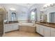 Main bathroom features tile floors, a garden tub, granite counters, a shower, and plenty of space at 2347 123Rd E Pl, Parrish, FL 34219