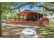 Exterior of a wooden pavilion with a covered picnic area in a park-like setting at 2347 123Rd E Pl, Parrish, FL 34219
