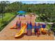 Community playground with swings, slides, and climbing structures set on mulch at 2347 123Rd E Pl, Parrish, FL 34219